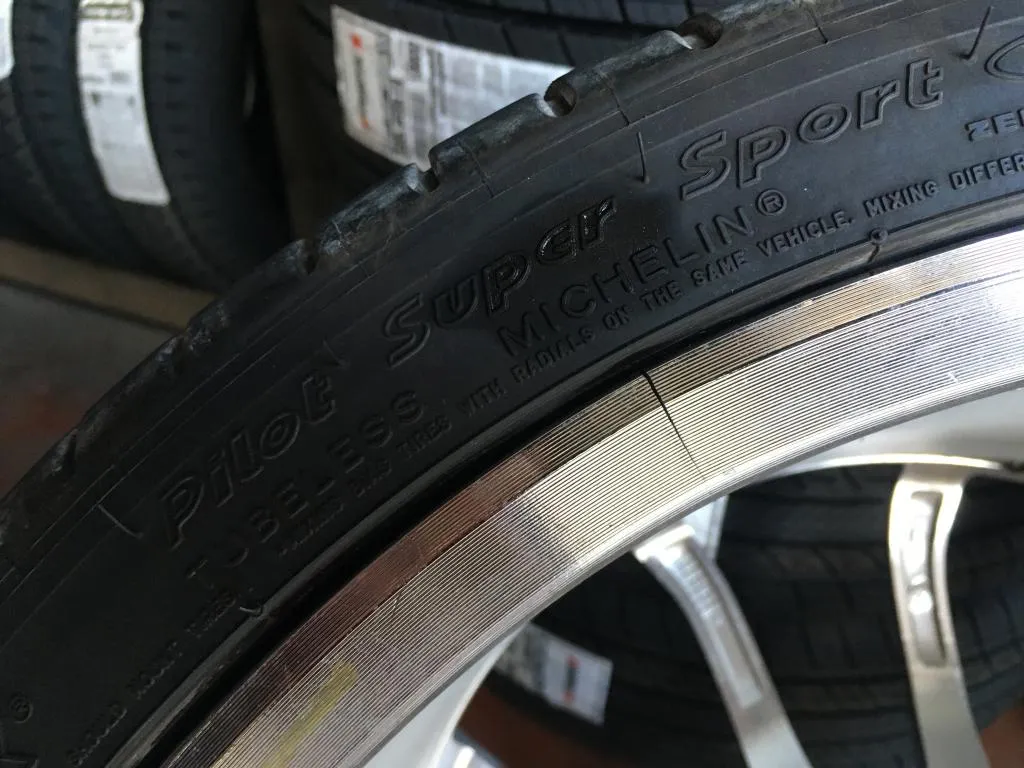 Cracked OEM C7 Corvette factory wheel showing structural damage